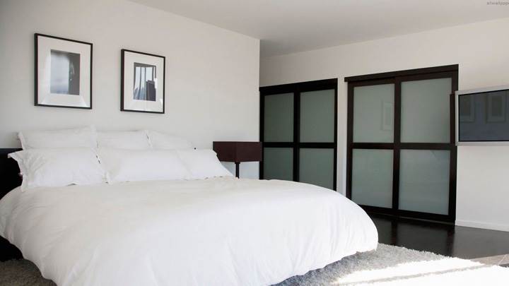 White Interior And Bed In Bedroom